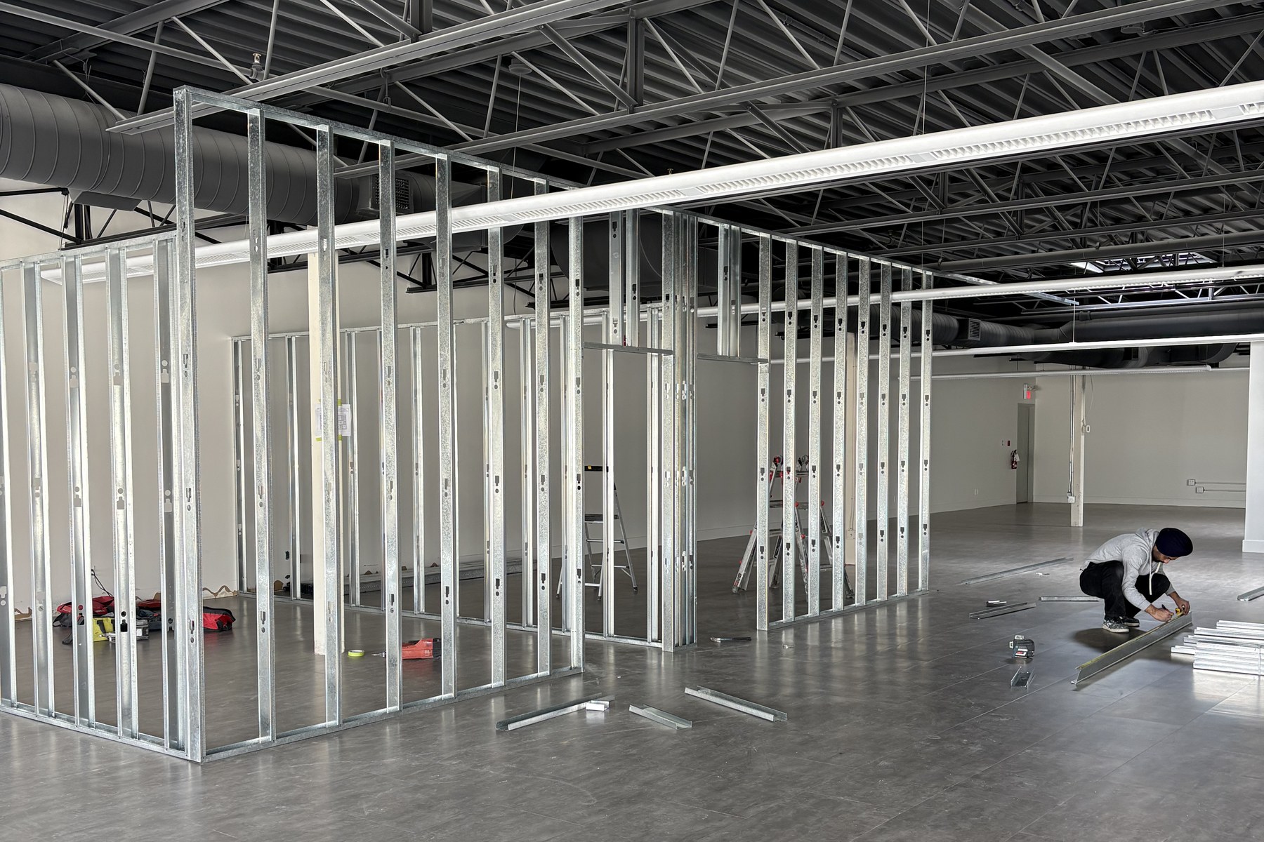 4,200 sq ft of open floor during metal framing at 52 Royal Road, Guelph